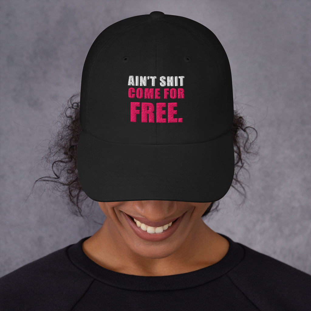 Model wearing black Ain't Shit Come for Free embroidered cap, front view