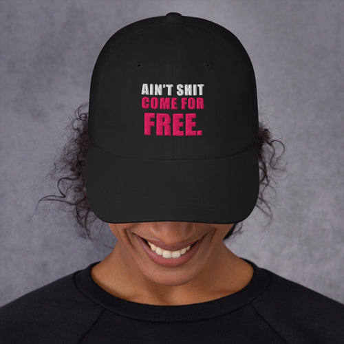 Model wearing black Ain't Shit Come for Free embroidered cap, front view