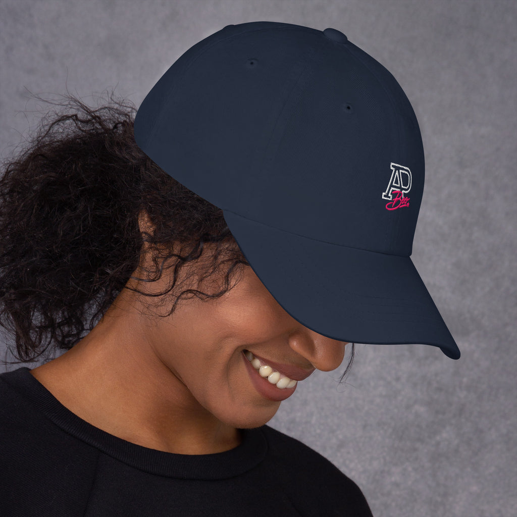 Model wearing navy APBoo embroidered cap, right-side view