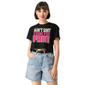 Model wearing black Ain't Shit Come for Free crop top, front view